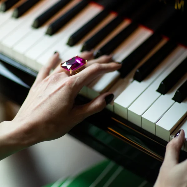 Photo of a woman's hands playing piano at The 'Quin House in Boston
