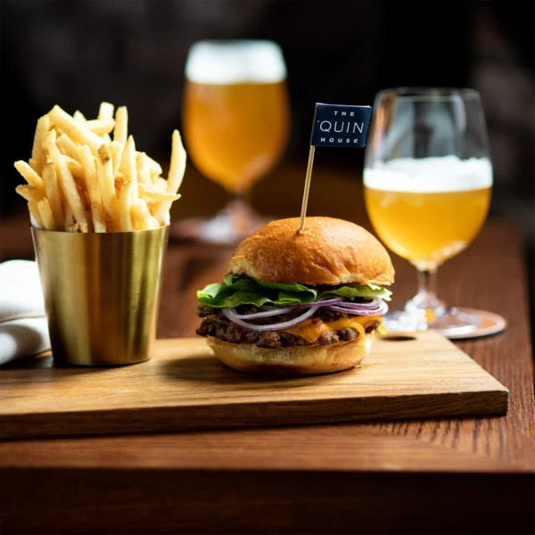 Photo of a burger and beer in a restaurant at The 'Quin House in Boston
